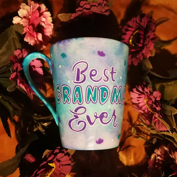 A pale blue purple  hand painted mug with the words "Best Grandma Ever"