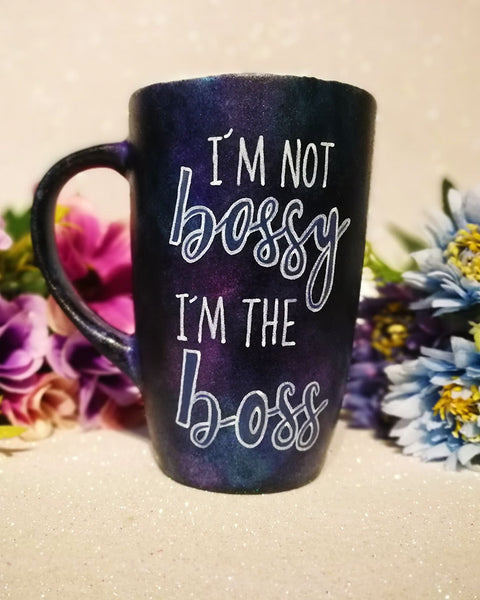 A Dark sky hand painted mug with the words "I'm not bossy , I'm the boss"