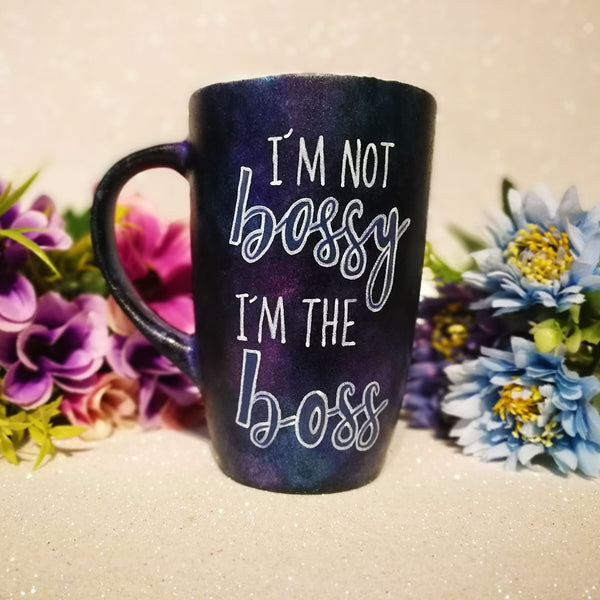 A Dark sky hand painted mug with the words "I'm not bossy , I'm the boss"