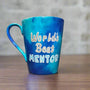 A Blue hand apinted mug with the words "Worlds best Mentor"