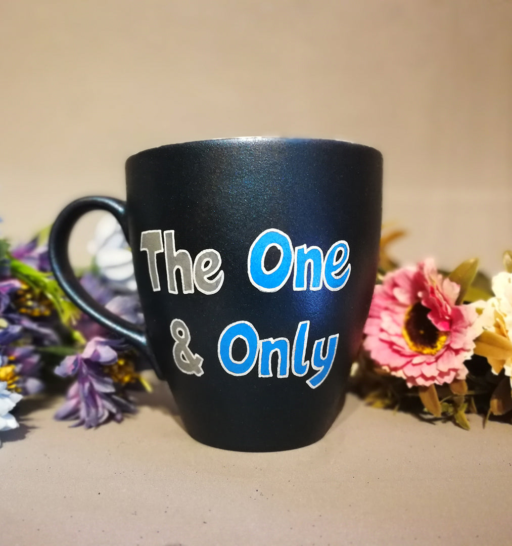 A Shimmery blue hand painted mug with the words "the one and only"