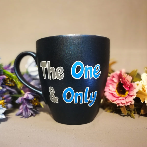 A Shimmery blue hand painted mug with the words "the one and only"