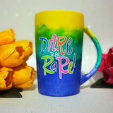 A gradient colored mug (from top yellow then green then ming blue) with the words 