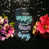 A Black galaxy hand painted mug with the words 