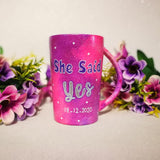 A hand-painted pink galaxy mug with the words 