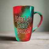 A Christmas colored Mug with the words 