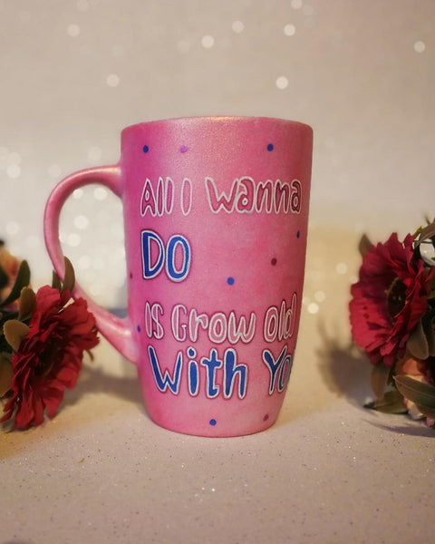 A hand-painted shimmery pink mug with the words