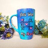 A hand painted blue galaxy mug with the sentence 