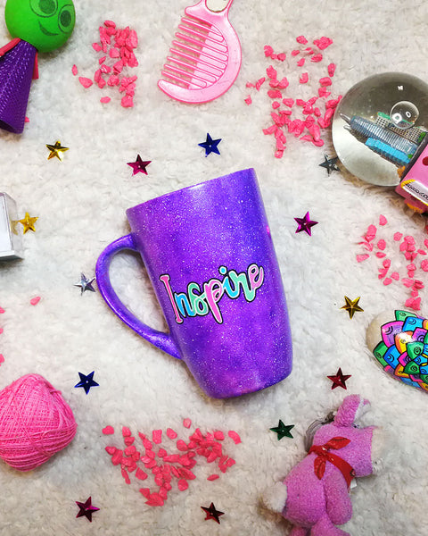 A Purple Galaxy hand painted mug with the word "Inspire"