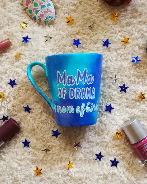 A blue hand painted mug with the words "mama of drama" and then below it #momofgirls