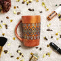 A Copper hand painted mug with patterns in the middle using black outliner and baby blue ,blue and gold dot art