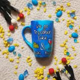 A blue galaxy hand painted mug with the sentence 