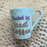 A baby blue hand painted mug with the words 