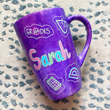 A Purple Galaxy Hand painted mug with the name 