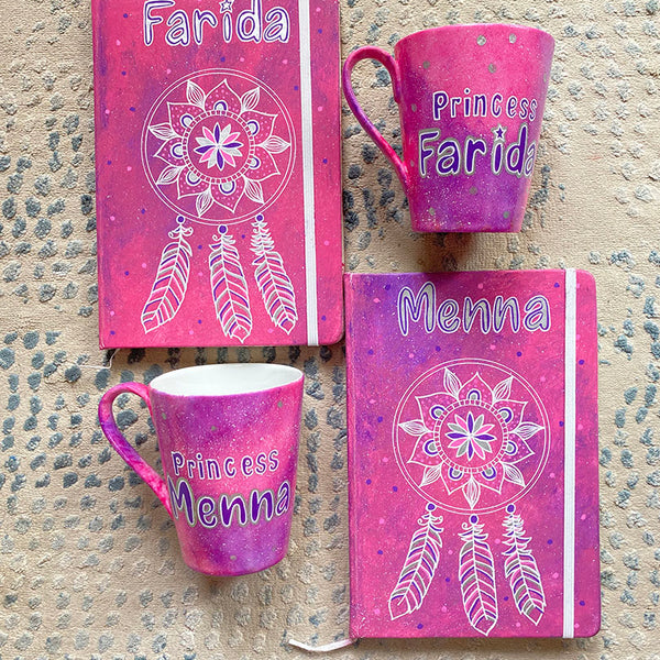 A Pink Galaxy Hand painted 2 mugs and 2 notebook, with the notebook having a dreamcatcher design and the mugs have names