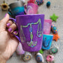 A Purple Galaxy hand painted mug with a libra design on it