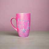 A Shimmery Pink hand painted mug with a libra design on it