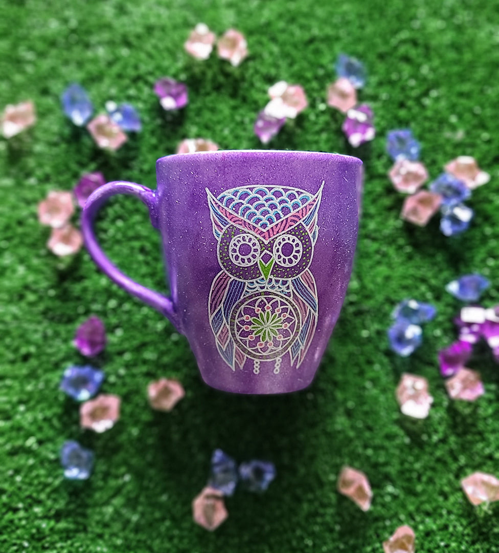 A Purple galaxy hand painted mug with an owl in zentangles drawn on it