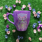 A Purple galaxy hand painted mug with an owl in zentangles drawn on it