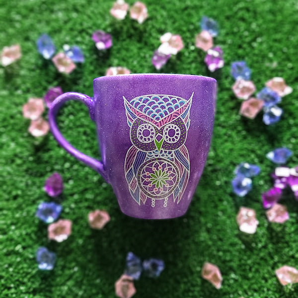 A Purple galaxy hand painted mug with an owl in zentangles drawn on it