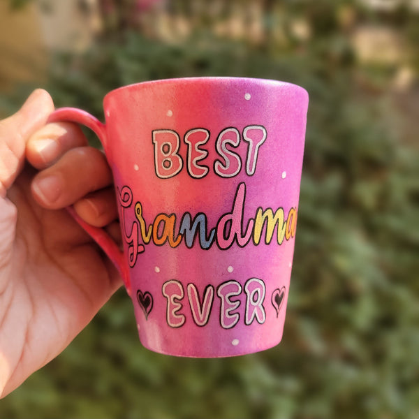 A Pink hand painted mug with the words "Best Grandma Ever"