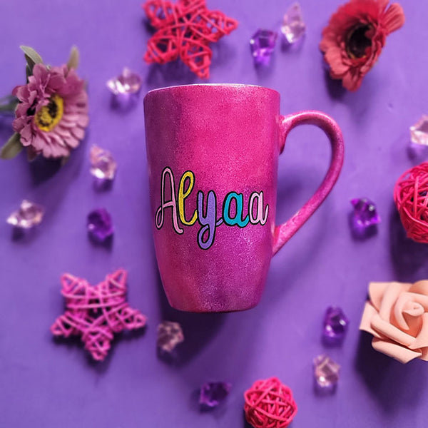 An indian pink hand painted mug with the name Alyaa