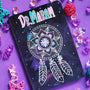 A Dark Sky hand painted notebook with a mandala drawn in white and the name "Dr.Maram" written in the top center