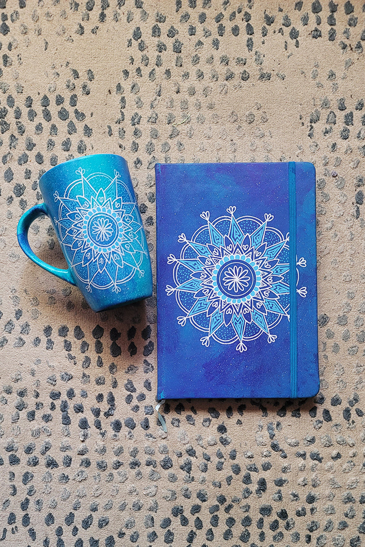 A Gift set of mug and notebook hand painted in blue galaxy with a mandala