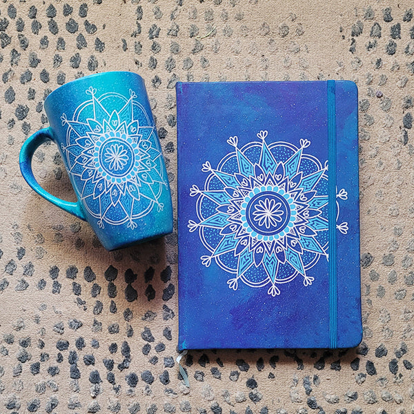 A Gift set of mug and notebook hand painted in blue galaxy with a mandala