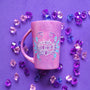 A hand-painted pink galaxy mug with cancer sign drawn on it