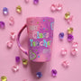 A Pink Hand painted Mug with the words "Best Class Teacher Ever" and school items scattered all over