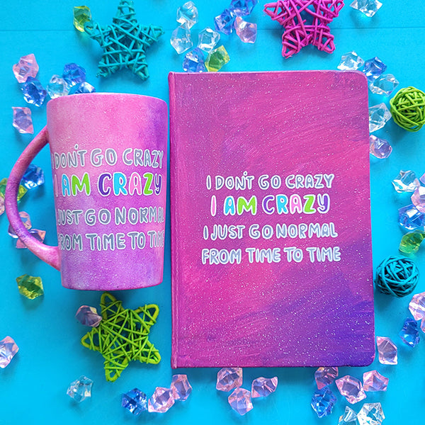 A Pink galaxy Hand Painted mug and notebook with the words "I Don't go Crazy, I Am Crazy, I just go normal from time to time"