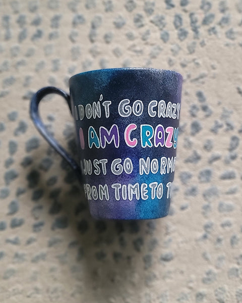 A Black galaxy Hand Painted mug with the words "I Don't go Crazy, I Am Crazy, I just go normal from time to time"