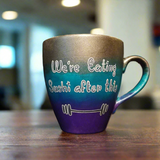 A gradient colored mug (Silver, turquoise and purple) with the words 