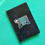 A Black Galaxy Hand Painted Notebook with the drawing of a football net and a football drawn at the corner . The number 30 written in the center of the net and under it the name Aly written