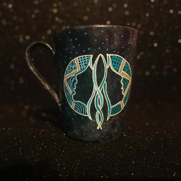 A Hand-painted dark galactic mug with a Gemini sign