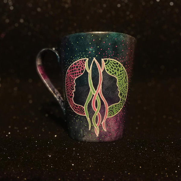 A Hand-painted dark galactic mug with a Gemini sign