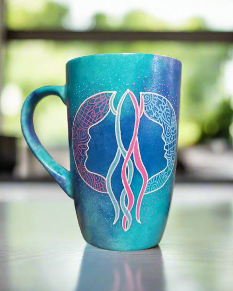 A Hand-painted blue mug with a Gemini sign