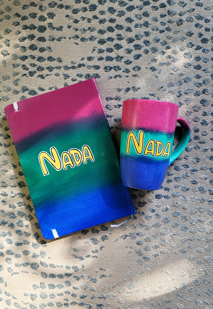 A Gift Set Hand painted in gradient colors (pink-green-blue) containing a mug and notebook with the name Nada written in the center in yellow