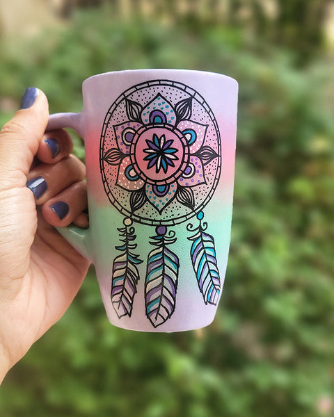 A gradient Hand Painted mug (Lilac, pink mint lilac) with a dreamcatcher in black and colored in purple baby pink and teal