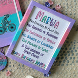 a gradient hand painted wooden frame (lilac-pink-mint-lilac) with the following words written inside 