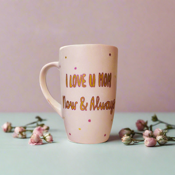 A Pastel Pink Mug with the words "I Love you mom. Now and Always" written in gold outlined by dark pink