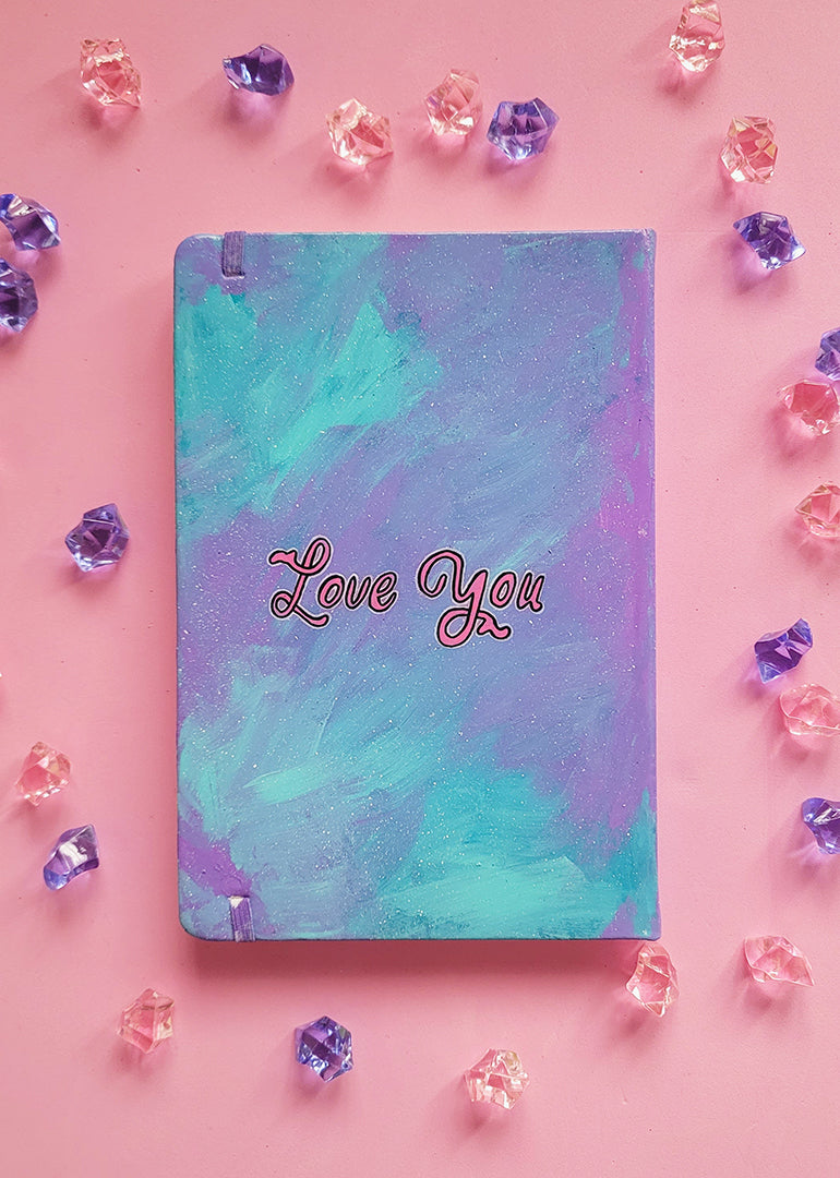 A Pale Blue Hand painted notebook with the words "Love You"