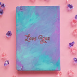 A Pale Blue Hand painted notebook with the words 