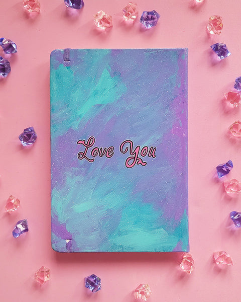 A Pale Blue Hand painted notebook with the words "Love You"