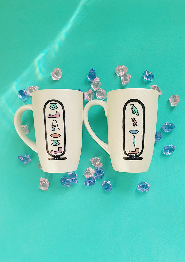 2 hand painted ivory mugs with pharaonic symbols