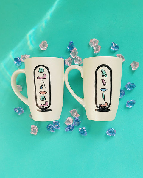 2 hand painted ivory mugs with pharaonic symbols