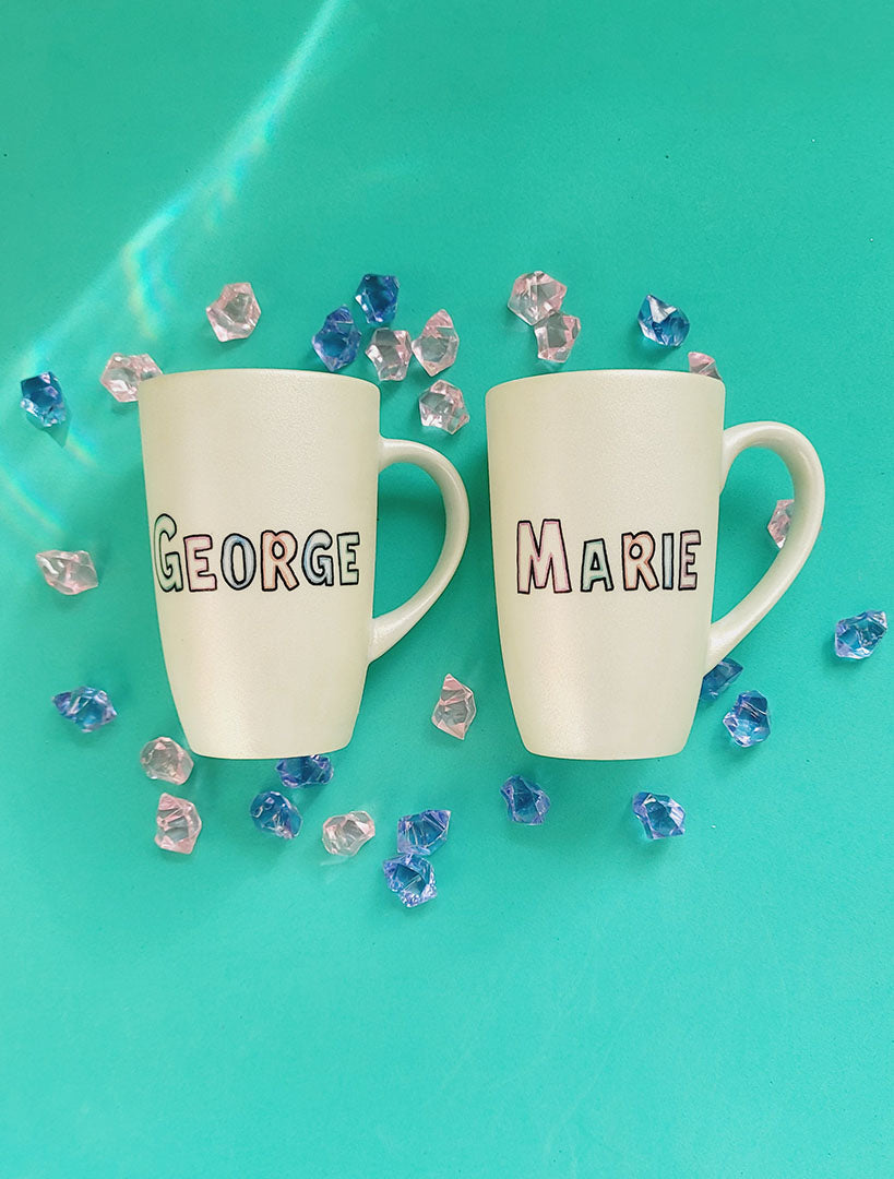 2 ivory hand painted mug with the names george and marie