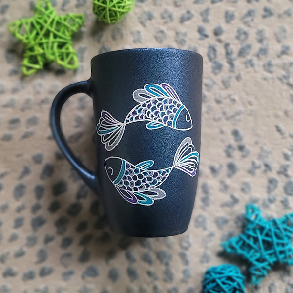 A Handpainted Shimmery blue  mug with a Pisces design on it