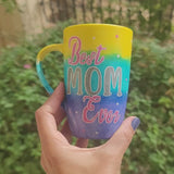 A Gradient colored hand painted mug with gradient colors of yellow turquoise and blue, with the words 